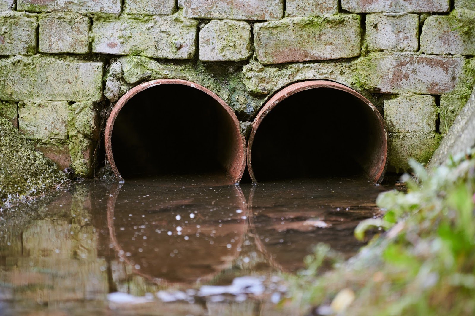 Water Flowing Through Two Pipes