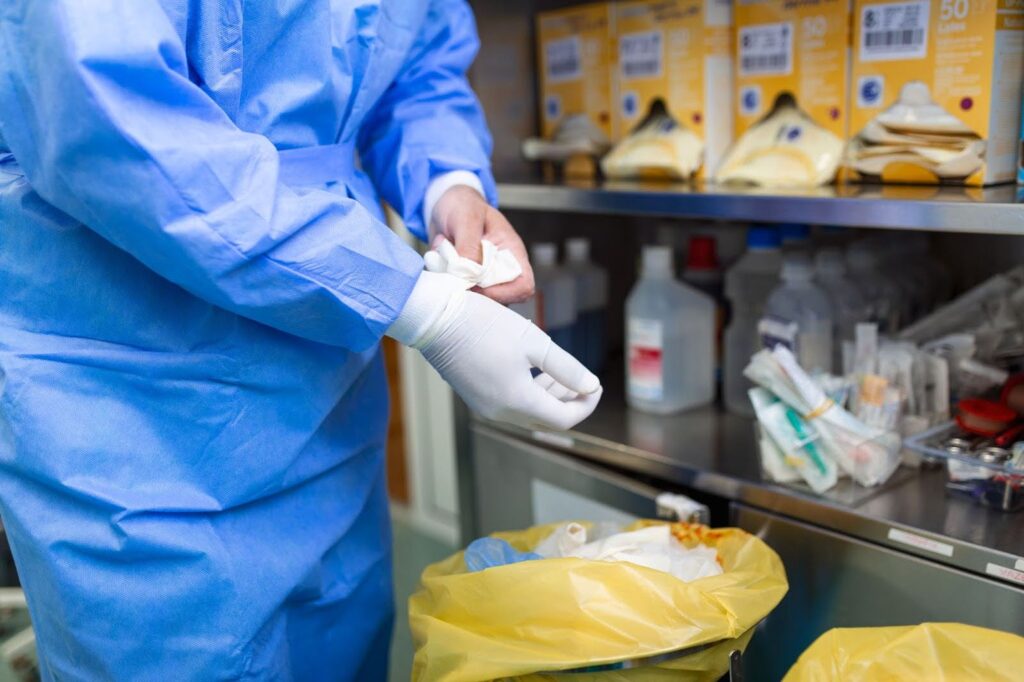 Worker Wearing Gloves Before Cleaning Hazardous Stuff